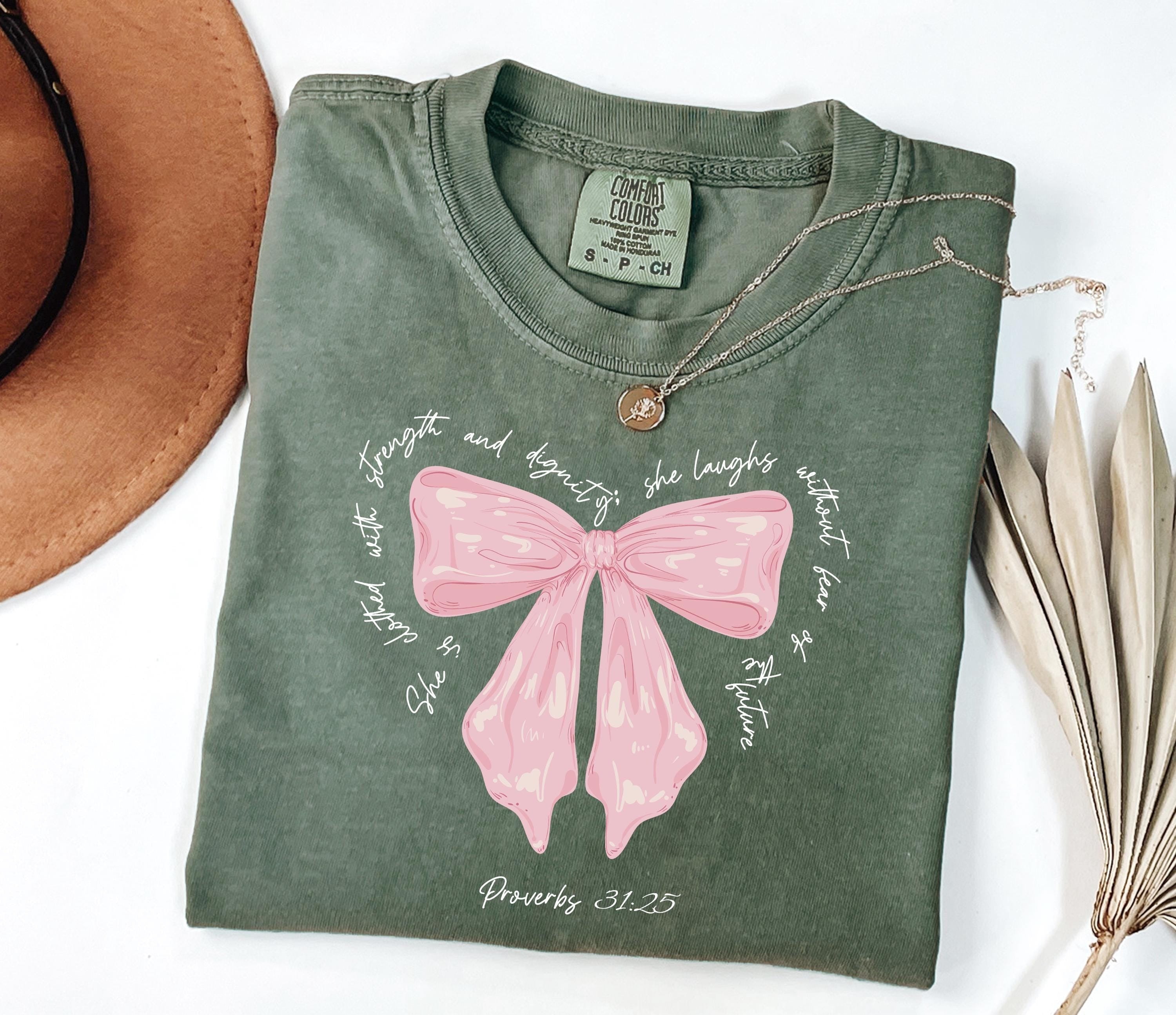 Comfort Colors® She Is Clothed With Strength Proverbs 31:25 Coquette Shirt, Bible Verse Shirt For Her, Cute Christian Gift, Mother's Day Gift, Coquette Mommy