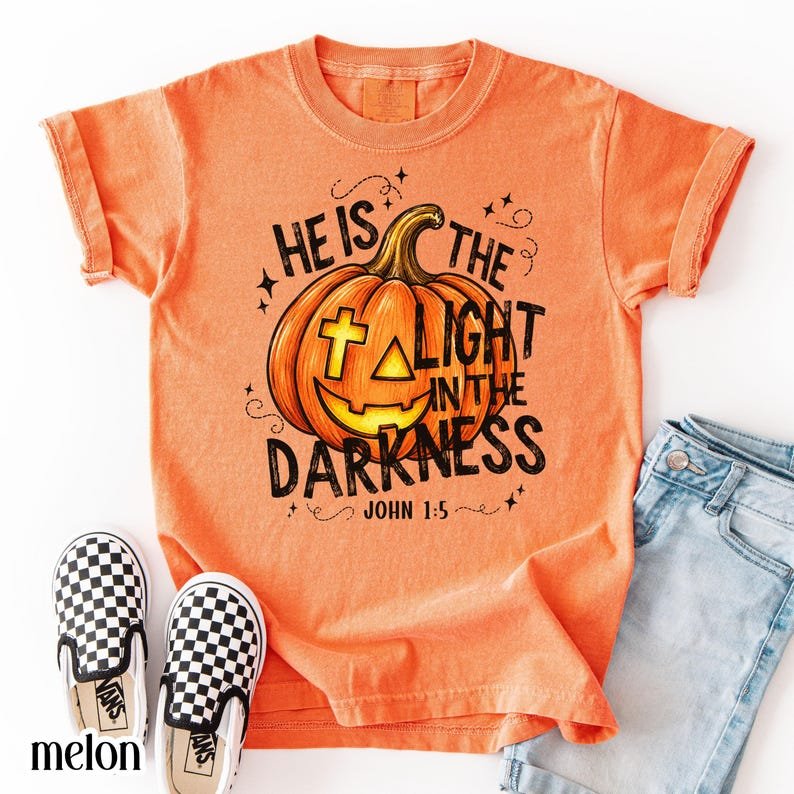 Christian Halloween Comfort Colors Shirt, He Is The Light In The Darkness Tee, Faith Pumpkin Fall Jesus CFNS06