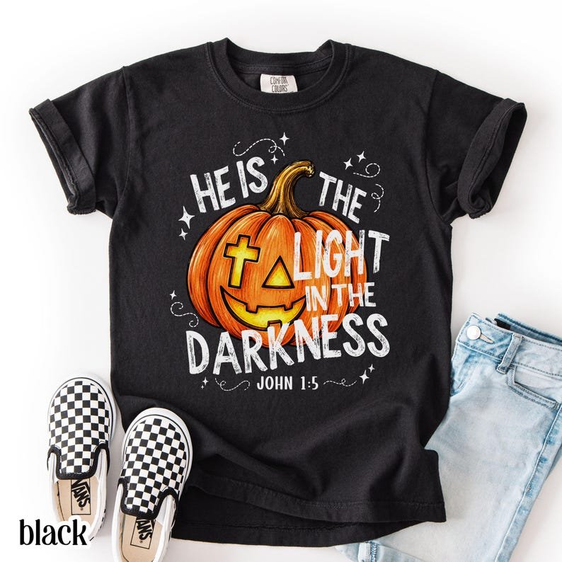 Christian Halloween Comfort Colors Shirt, He Is The Light In The Darkness Tee, Faith Pumpkin Fall Jesus CFNS06